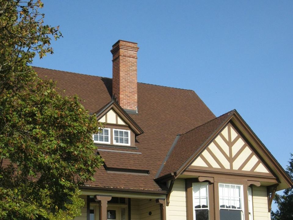 Brown asphalt to slate-grey interlocking metal shingle, Saanich